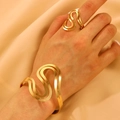 Minimalist gold S-shaped hollow cuff bracelet and ring set on satin background - Bracelet and Ring Set in Gold (7503+M-566)