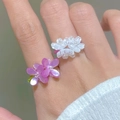 Handmade purple and white resin flower rings with rhinestones worn on hand - Two Flower Style