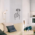 Minimalist black line wall sticker depicting a shush finger gesture in a modern home - Black