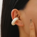 Macro detail of a cream white ribbed ear cuff showing the matte pearl shell-like texture - 20 Pearl White 12307