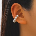 Detail of silver beaded ear cuff on model's ear showing polished metallic luster - 26 Bright Silver N-391