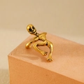 Vintage gold alien ear cuff with gothic climbing skeleton design on pink stand - Vintage Gold (X028)