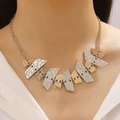 Detail of mixed-tone geometric alloy necklace with textured metal plates on model - Geometric Striped Patchwork Necklace (S227) / Gold and Silver Two-tone