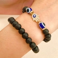 Detail of beaded bracelets featuring a gold Fatima hand charm and evil eye beads - Hamsa Hand Evil Eye Style / 2-Piece Set / Gold Black Eye Combination (06)