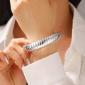 Detailed view of silver thick ribbed cuff bracelet on wrist with high polish finish - Threaded Bangle (3078) / Bright Silver