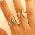 Detail of adjustable gold ring featuring white and grey glitter enamel drip design - Irregular Color Match Open Set of 2