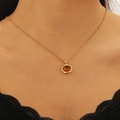 Maillard style golden necklace with oval tiger eye stone pendant worn by model - Irregular Oval Style (2344)