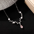 Macro detail of silver necklace with pearls and pear-cut pink gemstone pendant - Silver Waterdrop Pink Gemstone Style (N-755)