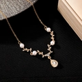 Close-up of golden antler necklace with pearls and a water-drop crystal pendant - Gold Branch Pearl Style (N-756)