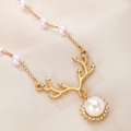 Detailed macro view of the antler pendant featuring white pearls and sparkling rhinestones - Gold Antler Pearl Style (6118)