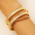 Luxurious gold-tone triple-layer coiled tubogas bracelet with a high-polish finish - KC Gold Spiral Elastic Bracelet