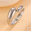 Close-up of silver spring-hinged metal cuff bracelet with modern teardrop design - Spring Hinge Waterdrop Open Bangle (6695) / Silver