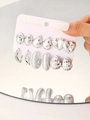 Set da 6 paia di orecchini geometrici in argento con forme a cuore e a goccia su carta - Argento (6134)