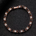 Pulsera tennis de oro rosa con pedrería blanca y negra alternada y cierre - Estilo Alterno de Piedras Negras y Blancas (7751)