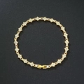 Pulsera trenzada dorada con diamantes de imitación y eslabones de trébol de cristal - Estilo de Flor con Strass Completo (DZ-804)