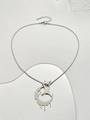 Macro detail of silver crescent and star pendant on a snake chain with mirror reflection - Lava Moon Star Necklace (M-299) / Silver