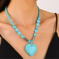 Retro turquoise heart pendant necklace featuring irregular blue beads on a female model - Large Heart Antique Silver Carved Style (古银蓝色10240)