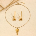 Golden fluid heart jewelry set featuring molten heart necklace and long drop earrings - Lava Heart Necklace Earring Set