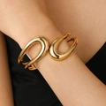 Minimalist wide geometric spring open cuff bracelet in a polished golden finish - Hollow Water Drop Bangle (9157) / KC Gold