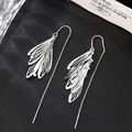 Elegant long silver leaf tassel earrings on premium black textured background display - Hollow Leaf Tassel Style / Silver
