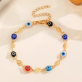 Bracelet œil porte-bonheur doré avec perles colorées et breloques spirales - Bracelet Mauvais Œil (G-468) / Bracelet Mauvais Oeil Doré
