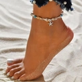 Bohemian anklet featuring natural shells, blue beads, and a silver starfish pendant - Starfish Conch