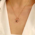 Rose gold heart pendant with MOM lettering and black projection stone on woman neck - KC Gold MOM Heart Style (A-174-B)