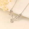 Silver-toned reindeer antler necklace featuring a sparkling gemstone heart pendant - Silver Antler Projection Style (7299)