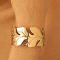 Adjustable golden hollow leaf cuff bracelet with a polished mirror finish for women - Golden Hollow Leaf Wide Cuff Bracelet (11)