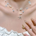 Multi-layer shell pearl necklace featuring starfish pendant and light blue beads - Multi-Layer Light Blue Starfish Style (A-981)