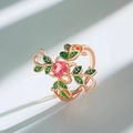 Rose gold ring featuring a pink gemstone and green enamel leaves in a nature-inspired style - Pink Diamond Green Leaf (A-971)