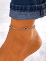 Chevillère dorée scintillante avec motifs de fleurs en cristal bleu et strass blancs - Style Pierre Bleue Doré