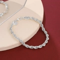 Silver twisted rope chain bracelet with a lobster clasp and a round metal tag pendant - Rope Chain (5318) / Silver