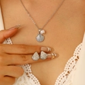 Silver shell jewelry set with necklace and stud earrings featuring pearls and crystals - Silver Minimalist Style