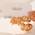 Three-piece set of gold hoop earrings and silver stud earrings on a display card - 01KC Gold (Style 1)
