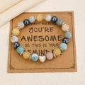 Bracelet perles fait main avec breloque cœur argent sur carte cadeau kraft - 16 Multicolore (2354)