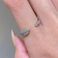 Macro shot of silver open ring with leaf design and white zircon stones on finger - Leaf Pattern (35030342) / Adjustable / Silver
