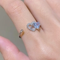 Detail of adjustable open ring featuring white zircon heart and light blue heart crystal - Heart Arrow (35030342) / Adjustable / Silver