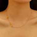 Detailed view of sun and moon pendant necklace on a gold chain worn by a model - 18K Gold Plated Stainless Steel Sun Moon Necklace (0718k Gold A-641)