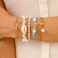 Five-piece Bohemian gold chain bracelet set with shell, starfish, and pearl charms - Five-Piece Bohemian Bracelet (WG-0806)