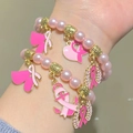 Set de bracelets à perles roses et pendentifs ruban rose pour la sensibilisation au cancer - Ensemble de Deux Bracelets