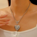 Close-up of vintage silver heart locket necklace with intricate Victorian floral engraving - Antique Silver (01 White K + Antique Silver M-128)