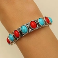 Detail of vintage bohemian bangle with turquoise and red stones on a female wrist - Mixed Red and Turquoise Style (A-560)