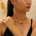 Golden chunky chain jewelry set with necklace bracelet and earrings on female model - Thick Chain Necklace Bracelet Earrings Set (0768)