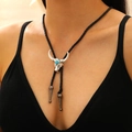 Detail of silver bull head bolo tie with turquoise stone and black braided leather cord - 02 White K 6535