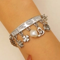 Silver charm bracelet featuring LOVE lettering, pearl, hearts and flower pendants - Silver