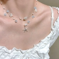Detail of multi-layer fishline necklace with starfish pendant and shell beads on neck - Multi-layer Bright Silver Style (A-981)