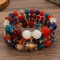 Boheems gelaagd kralenarmband met kleurrijke kralen en een gouden olifant hanger - Veelkleurige Olifant Hanger (M-538)