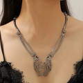 Collana con mani a scheletro a cuore gotico con finitura canna di fucile - Stile Cuore di Scheletro Gun Black (WG-0157)