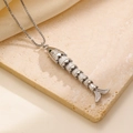 Polished silver fish pendant necklace with movable joints and green stone eyes - Silver Articulated Joint Fish (1346) / Steel